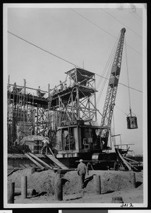 View of a bridge under construction, showing a crane