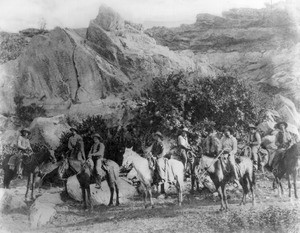 Portrait of an outfit of cowboys in the mountains, ca.1898