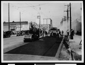 Workers during asphalt street paving