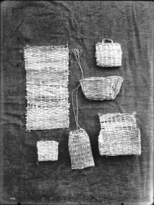 Six unidentified Indian baskets on display, ca.1900