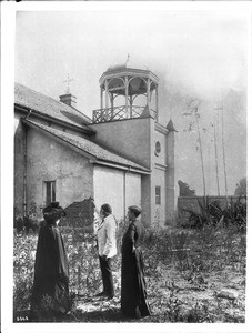 Don Antonio Coronel and Dona Marianna at the Plaza Church with Father Liebana, Los Angeles, ca.1890