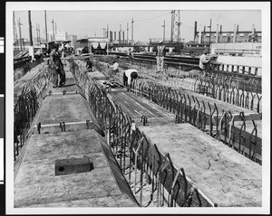 Construction site, showing rows of concrete slabs, ca.1930