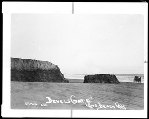 Horse-drawn carriage near the Devil's Gate rock formation on Belmont Beach in Long Beach, ca.1890