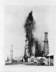 Union Oil gusher shaking its siphon tower on Signal Hill in Long Beach, ca.1925