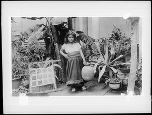 Little Mexican girl with an olla (water jar) in Mexico, ca.1905