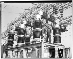 Man on the rigging of an electrical power plant