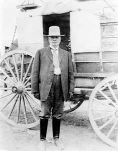 Portrait of a stage coach driver in front of his coach, California, ca.1880-1890