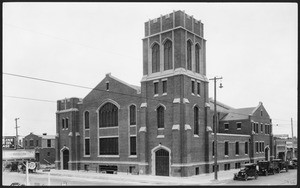 Exterior view of the Vermont Avenue Presbyterian Church, showing gas station, ca.1925