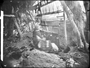 Navajo blanket weaver with loom, ca.1900