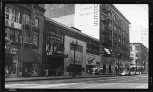 View of shops on Seventh Street looking towards Olive Street