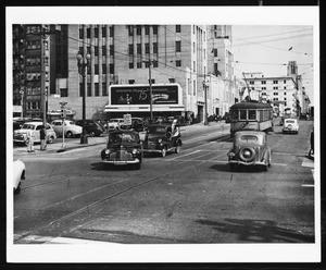 View across the intersection between 5th and Flower Streets, looking east, ca.1941