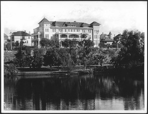 Exterior of the Park View Hotel (Lake View Hotel?) overlooking Westlake Park (later MacArthur Park), as seen from the lake, Los Angeles, ca.1908