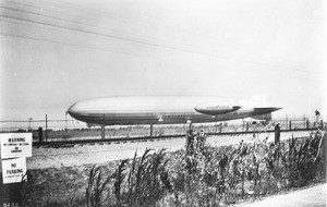 Graf Zeppelin and the small Goodyear pony blimp floating (or parked?) next to each other, 1929