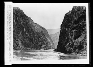 Boulder Canyon during construction of the Boulder Dam, showing river between two large mountains