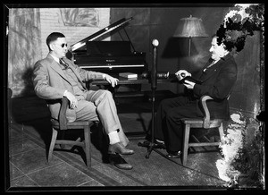 Two men listening to a "talking book"