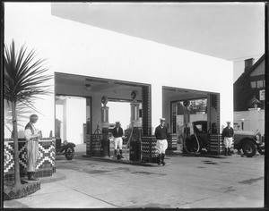 Gas station with Calpet gasoline and uniformed attendants, ca.1920-1929