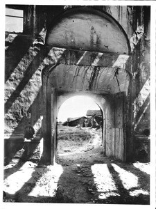 Looking through the south door of the ruins of the church of Mission San Fernando, California, 1898