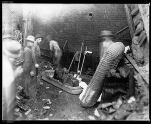 Elmer Frink's body being removed from bombed-out Los Angeles Times building, October 5, 1910