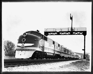 View of carriages being pulled by a small engine