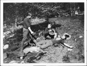 Men who were playing cards and drinking and one has shot another, ca.1930