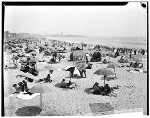 Sun-bathers on Venice Beach, showing lifeguard stand