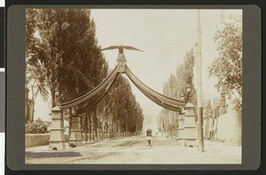 Trolley running under the Eagle Gate in Salt Lake City, Utah