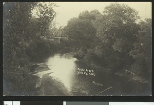 View of Cache Creek and a bridge in Yolo County, 1900-1940