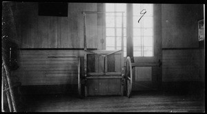 Interior view of East Side Railroad Station, showing what appears to be a wooden box on wheels, December 1, 1917