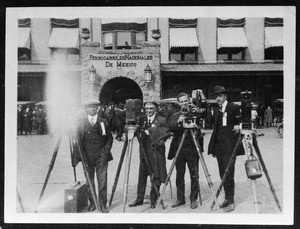 Four cameramen standing in front of Estación Colonia, Mexico, ca.1910