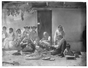 Three Hopi Indian weaving baskets in the village of Oraibi, ca.1901