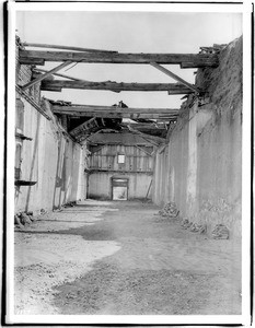 Ruined interior of the church of Mission San Antonio de Padua, California, looking toward the front door, ca.1904