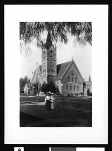 Exterior view of the first M.E. Church in San Bernardino, showing two women, ca.1900