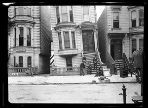 Exterior view of 377 Shatwell Street, showing the house tilted off its foundation, San Francisco, 1906