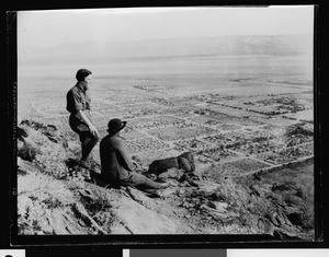 Two women on a mountainside overlooking the Coachella Valley, ca.1930