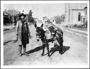 Hiram Martin Chittenden, author, with his burro, ca.1900-1920