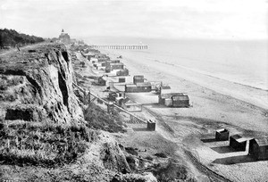 Palisade cliffs leading down to beach houses along the shore in Santa Monica, ca.1898