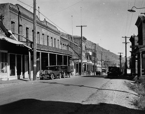 View of commercial "C" street in Virginia City, Nevada, showing the hills in the background, ca.1935