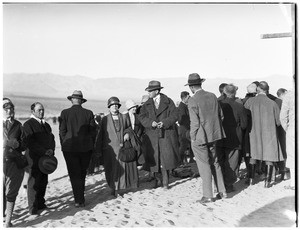 Group of people in the desert for a funeral