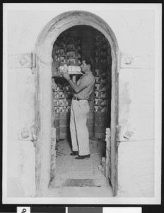 Factory worker in a kiln of a ceramics factory, ca.1935