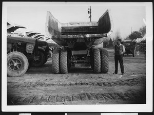 West Slope Construction Company vehicle, formerly a 25-ton Army truck, shown from the rear, ca.1920