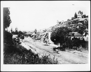 Fort Street ("Broadway" after 1890) between Temple and 1st Streets looking south-southwest showing vacant lots and scrubby hillsides, ca.1874-1885