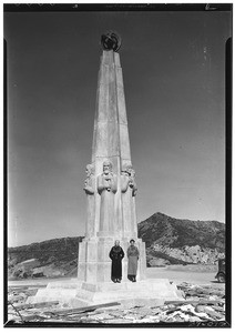 Two women posing in front of the Astronomers Monument in Griffith Park