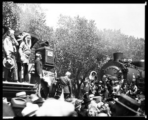 View of Engine 38 and costumed men at a recreation of the completion of the Southern Pacific Line, September 5, 1926