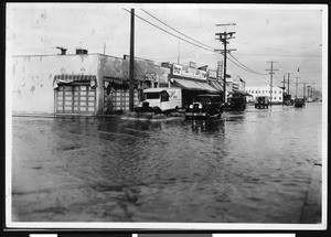 Flooded intersection of 66th and Normandie, January 1932