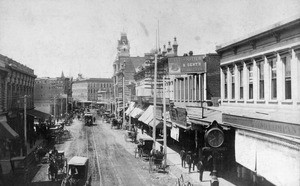 View of commercial Spring Street, looking south, showing horse-drawn carriages, ca.1881-1888