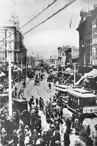 View of Spring Street looking north from First Street on the opening day of the cable-car line, June 8, 1889