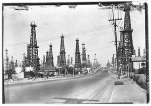 View of Long Beach Boulevard passing through Signal Hill, showing highway in an oil district, 1930