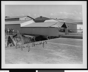 Flood damage to Warner Brothers Studio, showing the edge of the bridge, 1938