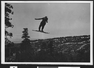 Ski jumper mid air, ca.1930