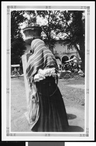 Woman near a potted plant in Mexico, ca.1905